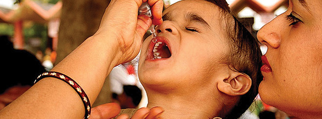 Little girl getting an oral vaccine